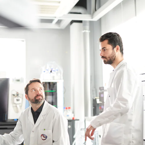 Male scientists working in the PMI laboratory, Cube