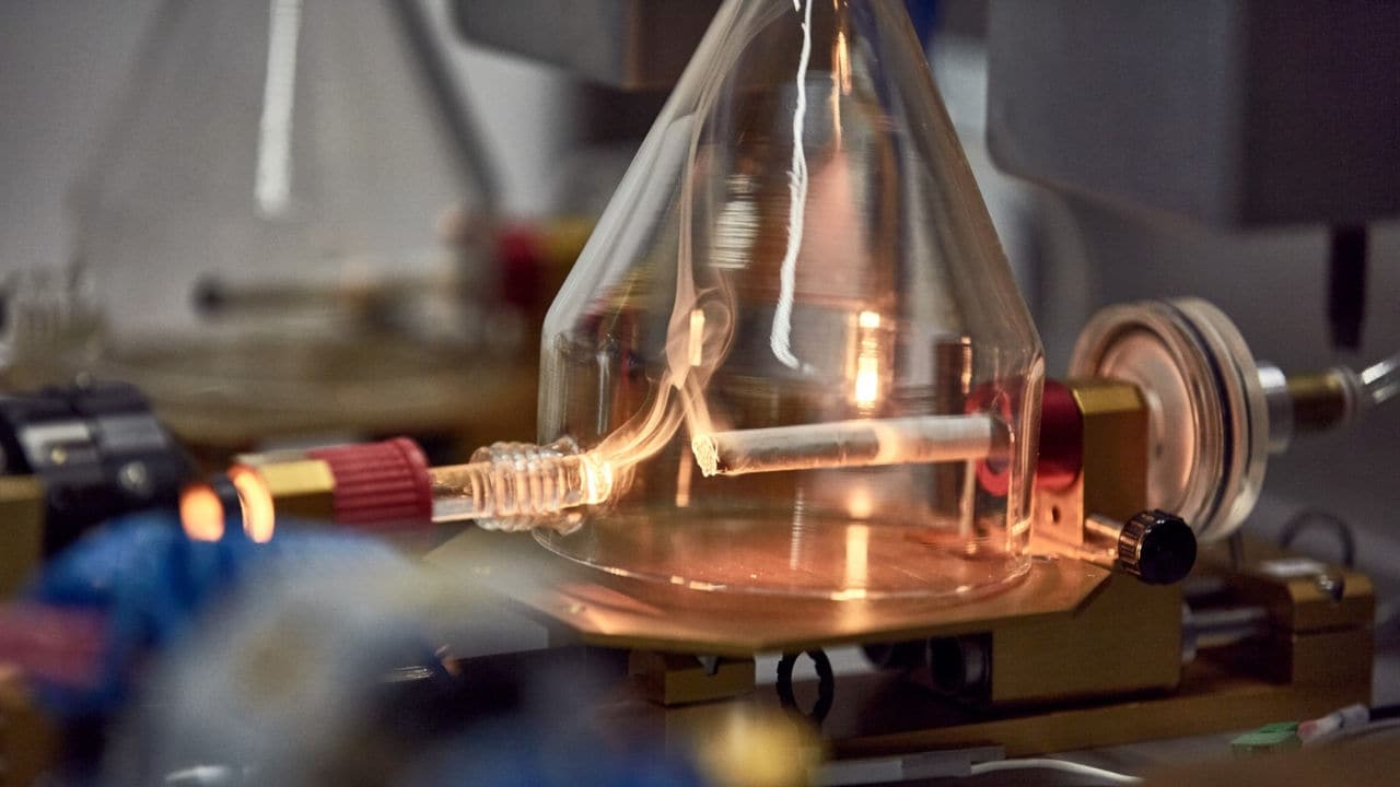 Chemical process of burning tobacco in a glass container.