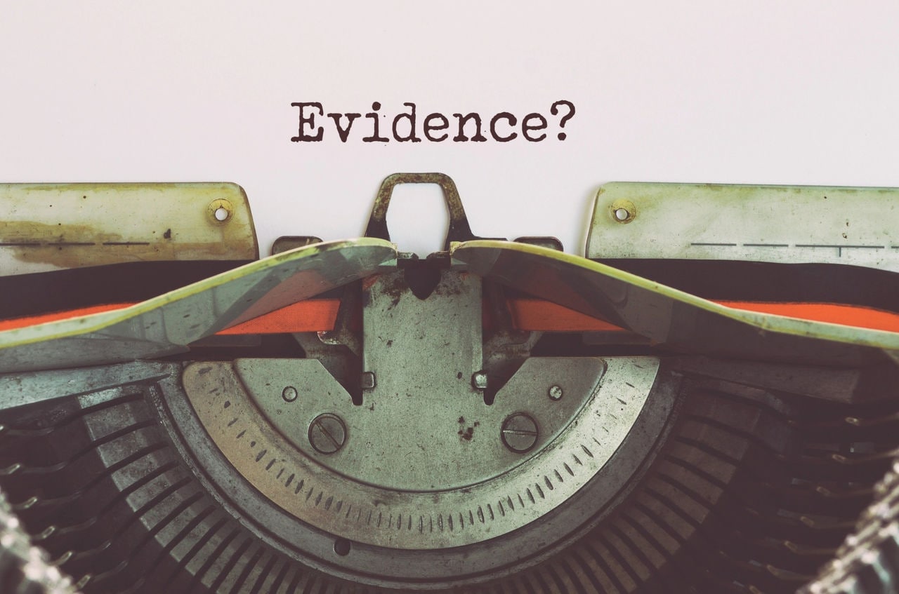 Word evidence typed on a typewriter.