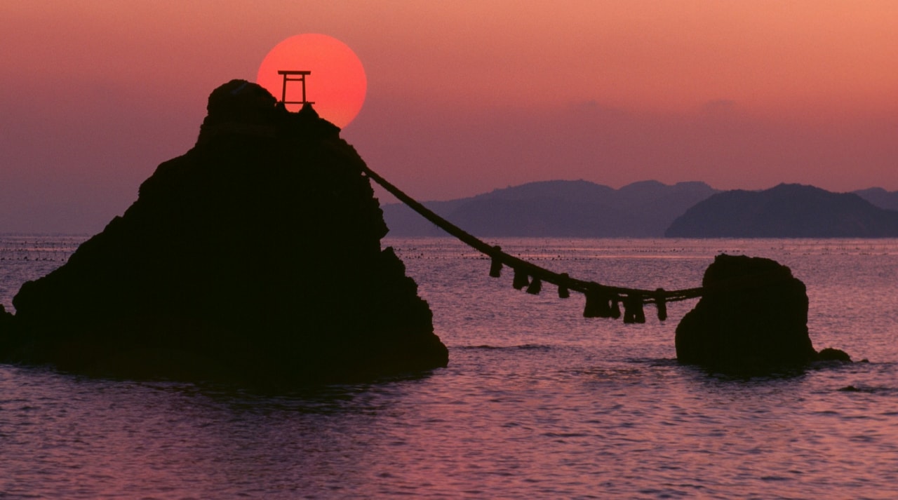 "Wedded rocks". Meoto Iwa  a religious site for Shinto religion at sunrise.