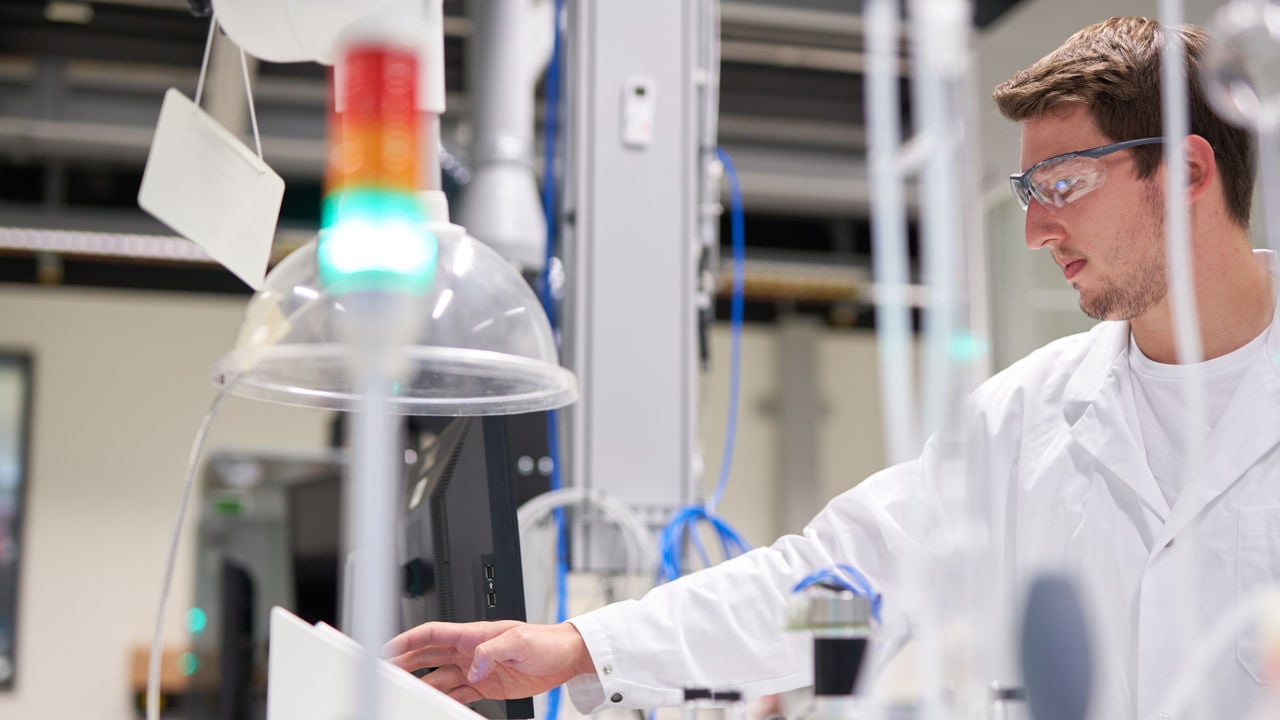Male scientist working in the PMI laboratory, Cube