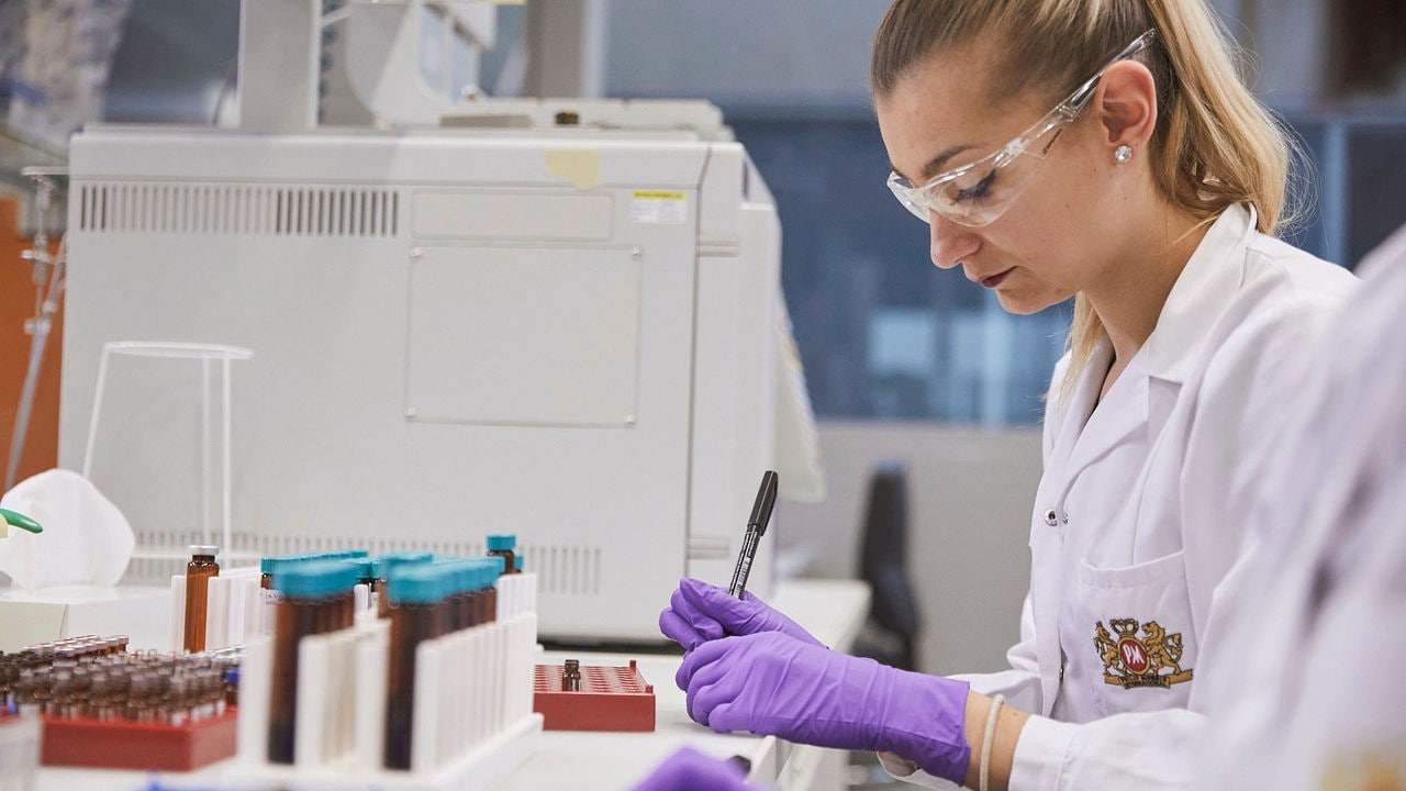 Female scientist working in the PMI laboratory, Cube