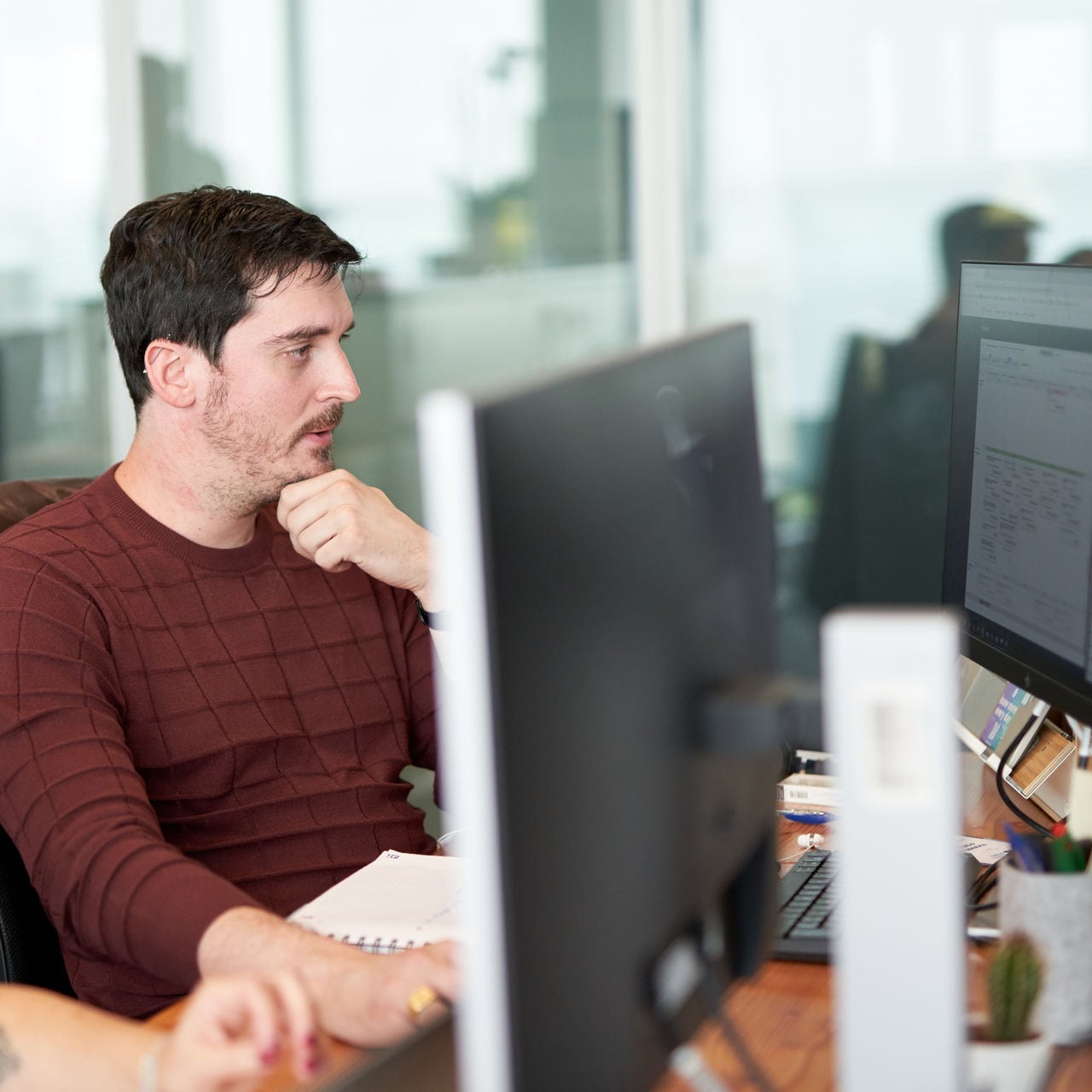 Two people working on computers